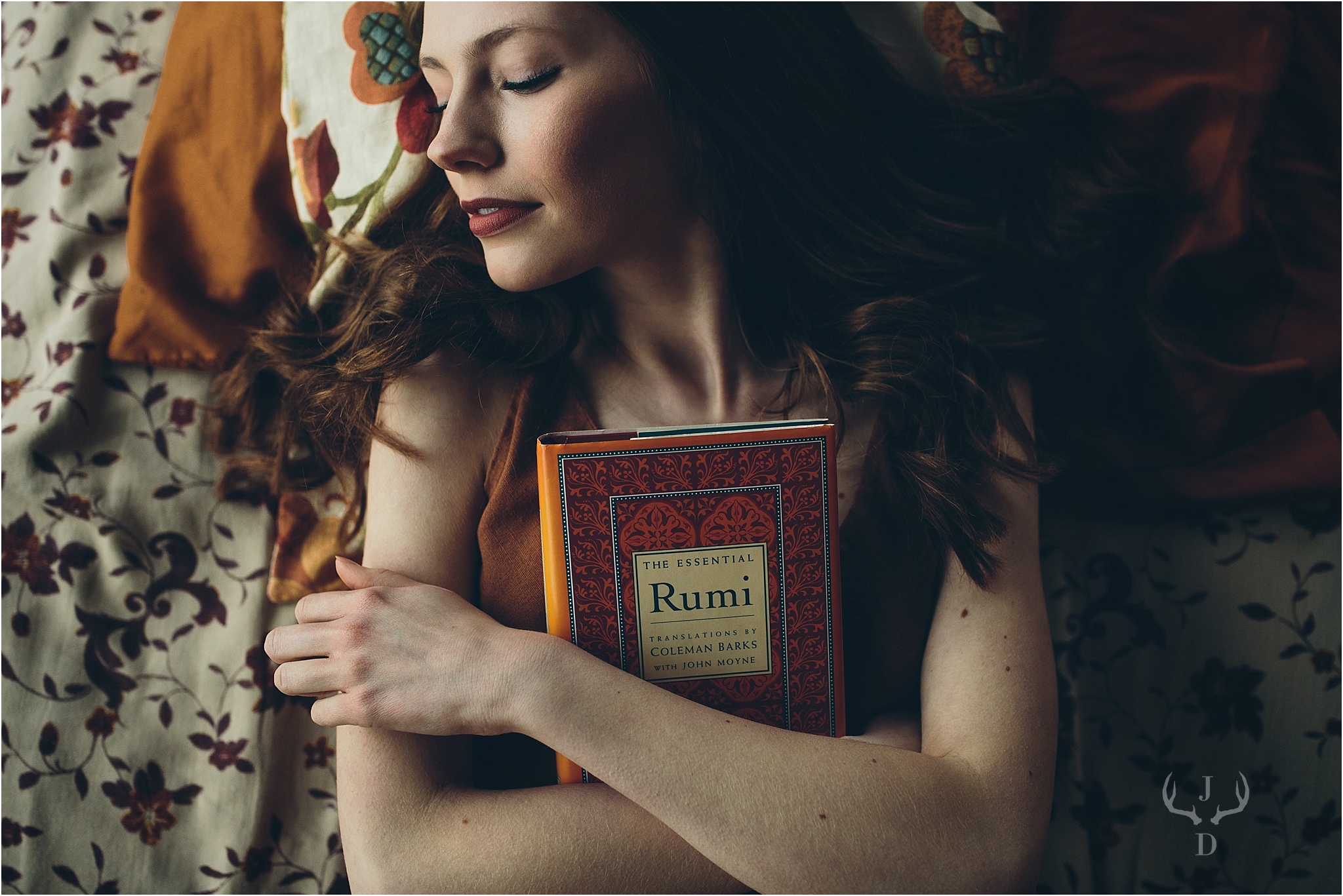  Senior picture lying down with Rumi book taken in Madison, WI. 